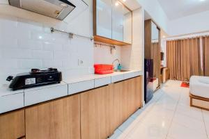 Warm and Homey Studio Room Casa de Parco Apartment By Travelio