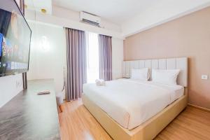 Homey and Spacious 3BR Sky House BSD Apartment By Travelio