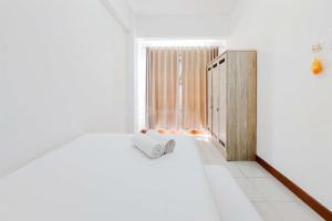 Modern Look 1BR Apartment at Scientia Residence By Travelio