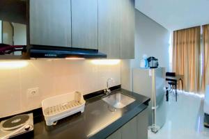 Cozy and Minimalist Studio Room Ciputra International Apartment By Travelio