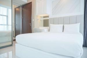 Best Spacious and Nice 3BR at 28th Floor Casa Grande Apartment By Travelio