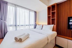 Good and Homey Studio at Collins Boulevard Apartment By Travelio