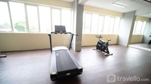 Cozy Living and Tidy 2BR at Puncak Dharmahusada Apartment By Travelio