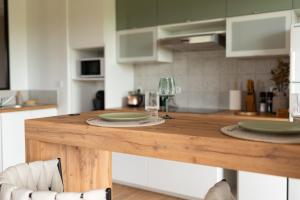 Appartements Appartement Premium jacuzzi terrasse climatisation : photos des chambres