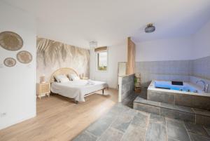 Appartements Appartement Premium jacuzzi terrasse climatisation : photos des chambres