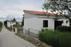 Ferienhaus mit überdachter Terrasse und Meerblick 