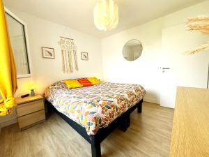 Appartements L'atelier Chic - Wifi fibre - Parking privee - Balcon - NETFLIX : photos des chambres
