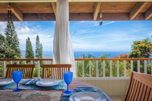 Experience ocean views at Hale Mauka, a spacious 3-bedroom retreat in Captain Cook, HI.