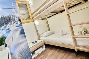 Résidence Divaria - Studio cabine 4 personnes à Tignes au pied des pistes et proche des commerces dans le quartier du Lac. Situé en rez de jardin d MAE-2114