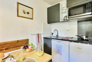 Résidence Divaria - Studio 4 personnes à Tignes au pied des pistes et proche des commerces dans le quartier du Lac. MAE-2136