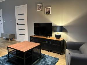 TOTU TODAY-SIENNA GROBLA APARTAMENTY, Faktura VAT, self check-in