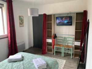 Appartements T2 Cosy - 70m2 au Coeur de ville : photos des chambres