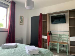 Appartements T2 Cosy - 70m2 au Coeur de ville : photos des chambres