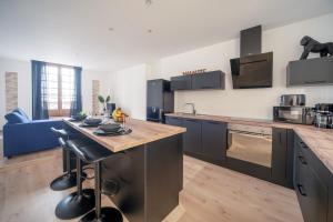 Appartements MyAppart71 - La prefecture - Appartement en Coeur de Ville : photos des chambres
