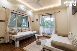 Grey Hues with Swimming Pool & Lawn at Karjat by StayVista