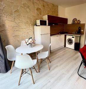 Le Clos des Baleines RDC avec jardin et 1 place de parking privée dans un garage