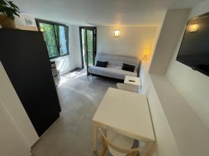 Appartements Studio neuf rez de jardin dans chalet individuel : photos des chambres