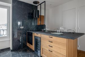 Appartements Le Versailles Suite classe 3 etoiles Vue Chateau & Potager : photos des chambres