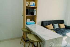 Elegant and Comfy 2BR Transpark Bintaro Apartment By Travelio