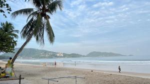 Patong Vacation Condos by Pam - 28 SQM modern condos with private bathroom, kitchen, King Bed, free WiFi and 65 inch smart TC