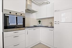 Charming White Apartment with Balcony and Parking