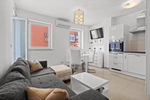 Charming White Apartment with Balcony and Parking 