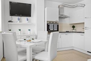 Charming White Apartment with Balcony and Parking 