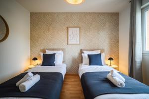 Maisons de vacances L’Ebene ~ Clim ~ Jardin ~ Parking ~ Toulouse : photos des chambres