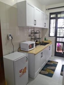 Azania cozy Units 5 minutes to Sarit Centre