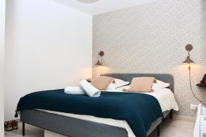Appartements La Source - Spacieux T2 au coeur du village, a 5min des plages : photos des chambres