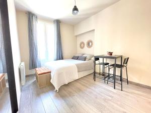 Appartements Studio neuf a 2 pas du metro : photos des chambres