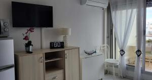 Studio cabine climatisé avec parking au Couchant