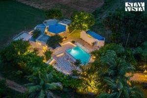 StayVista at Wellnest Natural Farms with private pool 4 hours from bangalore