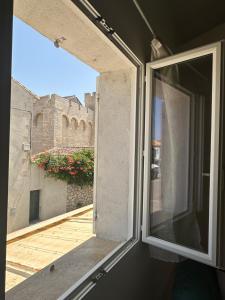 Appartements Appartement avec vue sur l eglise des Saintes : photos des chambres