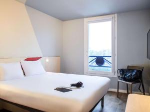 Hotels Hotel Ibis Budget Nantes Ouest Atlantis Coueron : photos des chambres