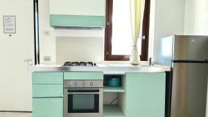 M375 - Marcelli, bilocale con giardino in residence con piscina