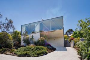 Architectural glass house with ocean views