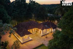 CVM House with Lawn at Thiruvalla by StayVista