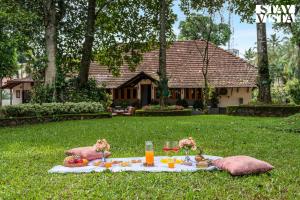 CVM House with Lawn at Thiruvalla by StayVista