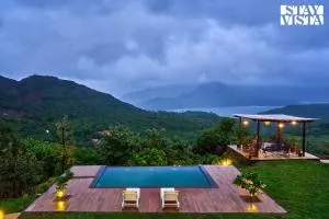 Waterfront Villa with Infinity Pool & BBQ Grill at Pune by StayVista - Mulshi