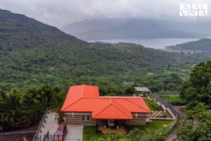 Waterfront Villa with Infinity Pool & BBQ Grill at Pune by StayVista