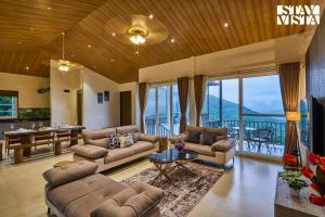 Waterfront Villa with Infinity Pool & BBQ Grill at Pune by StayVista