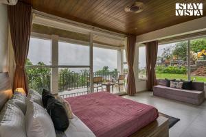 Waterfront Villa with Infinity Pool & BBQ Grill at Pune by StayVista