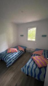 Maisons de vacances Maison familiale en bordure du lac - O bois flotte : photos des chambres