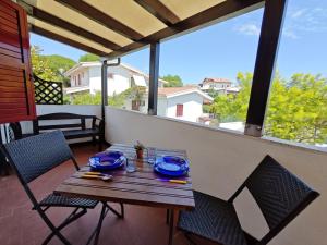 L03 - Grazioso bilocale con giardino e posto auto