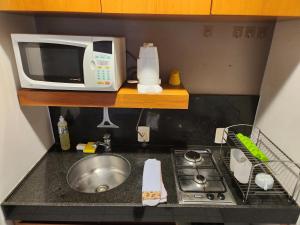 Quarto, sala e varanda em Copa