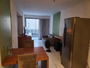 Quarto, sala e varanda em Copa