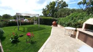 Sissi House - Trilocale con Giardino - Porto Pollo