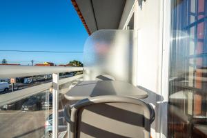 EnSuite 3 Laranja Frente Rochedo