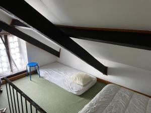 Maisons de vacances La petite maison dans le jardin : photos des chambres